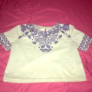 This is a white shirt with a pretty blue design